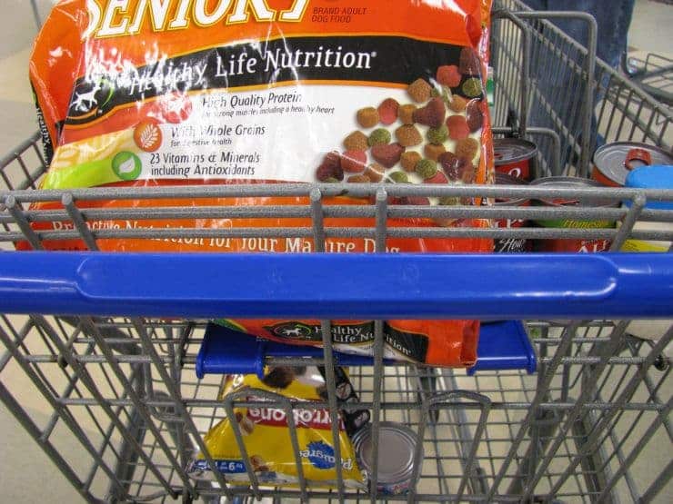 pedigree and purina dog food in a shopping cart